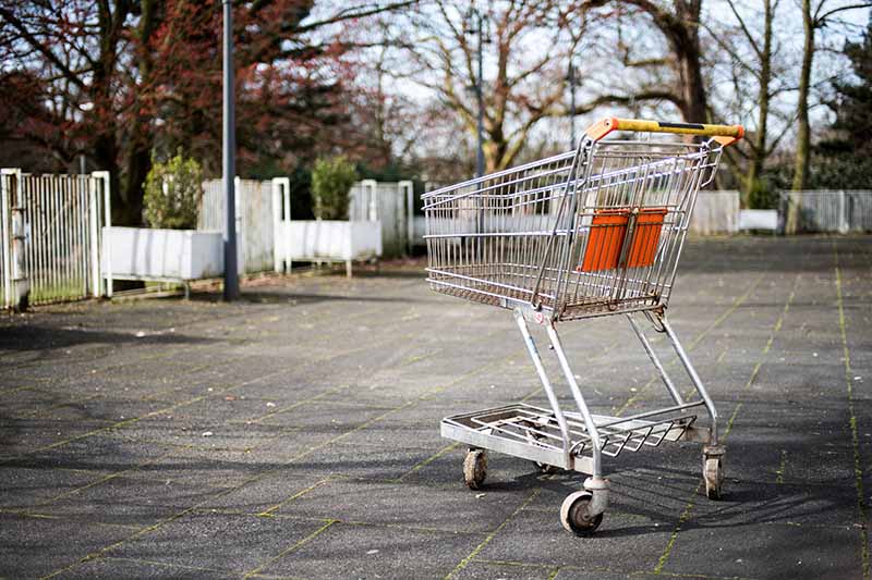 Picture of an abandoned shopping trolley in a car park